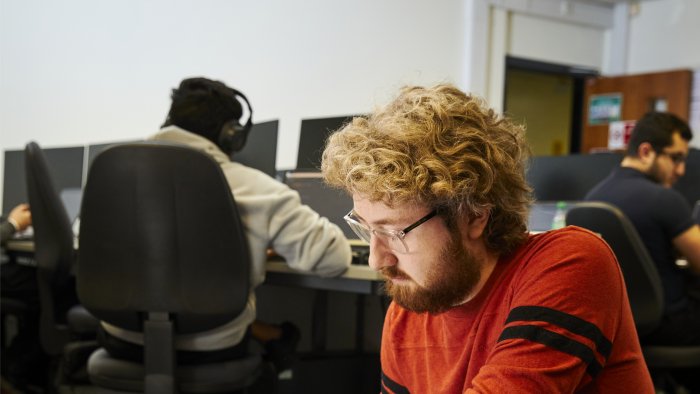 Students working on computers in a lab session