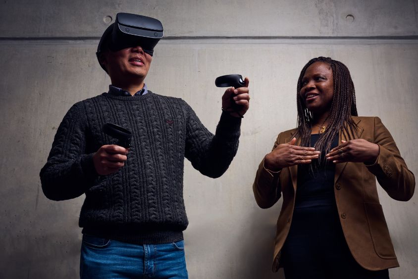 Two people using a virtual reality console