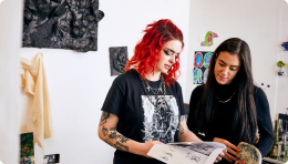 Students looking at artbook