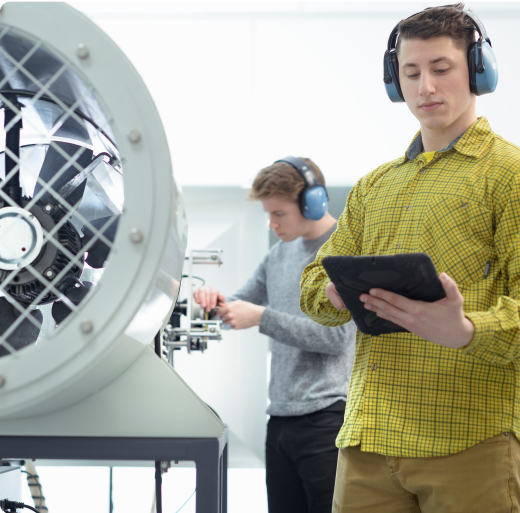 Students working in lab with fan