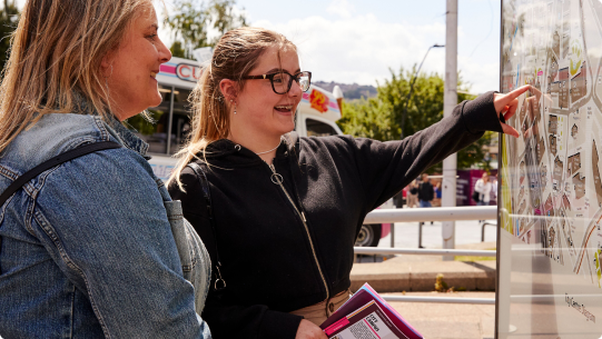 Students looking at map