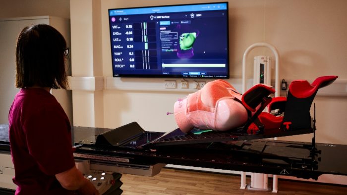 A student stood looking at the results of a live laboratory test on a screen