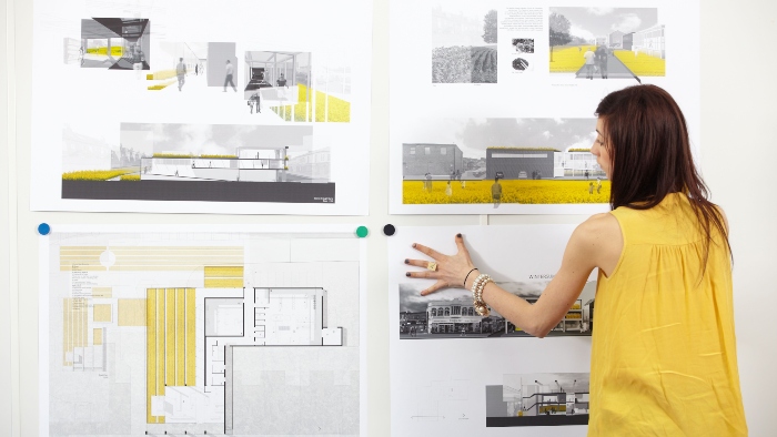 Person studying architecture drawings