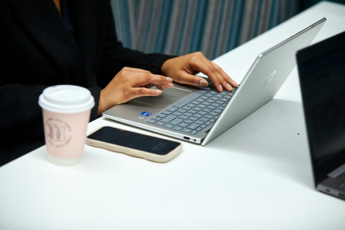 Hands typing on a keyboard