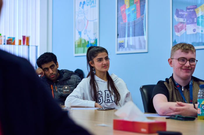 Three students in a classroom