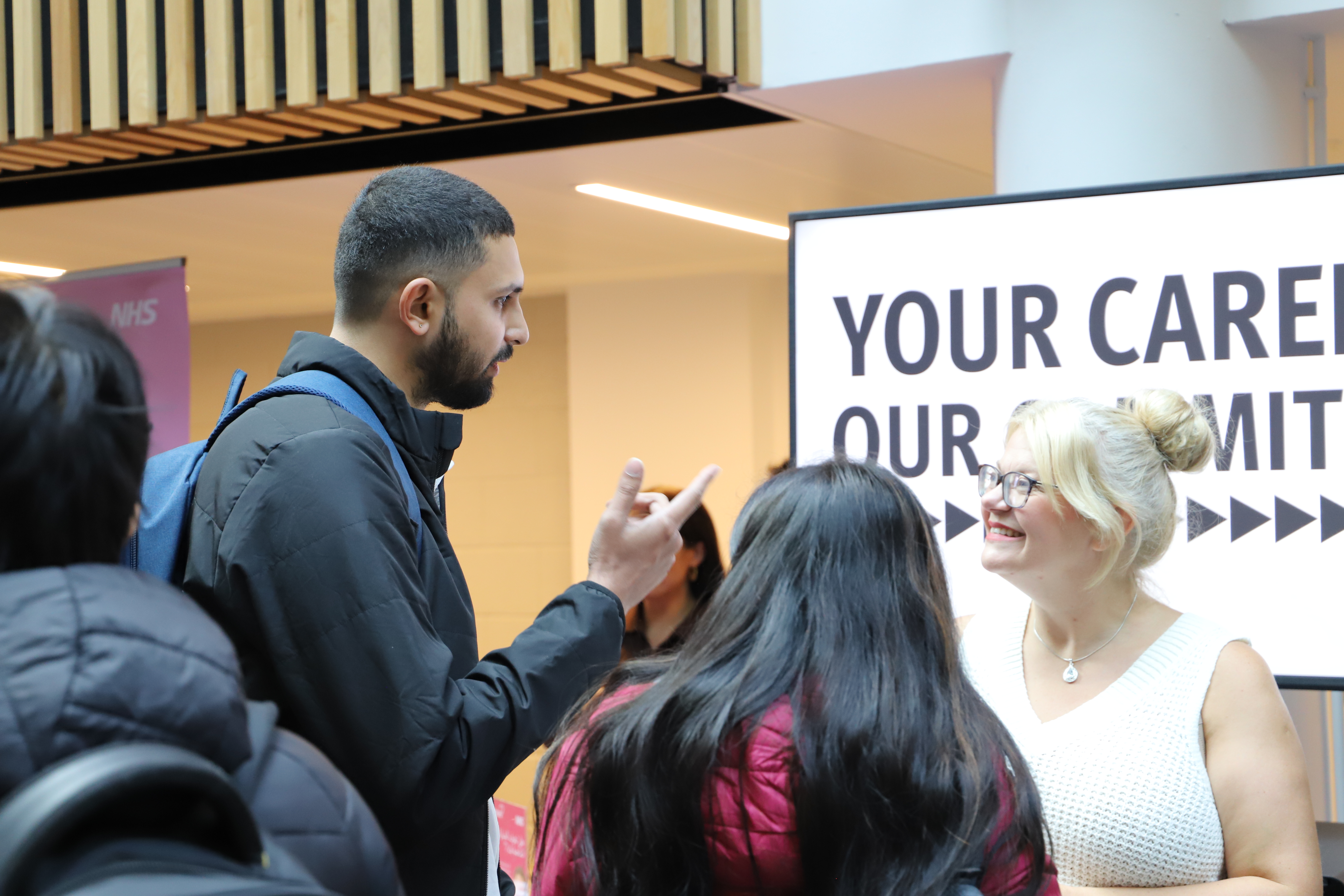 students and staff at the international market place