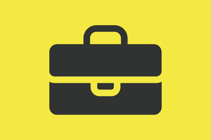 Grey briefcase on yellow background