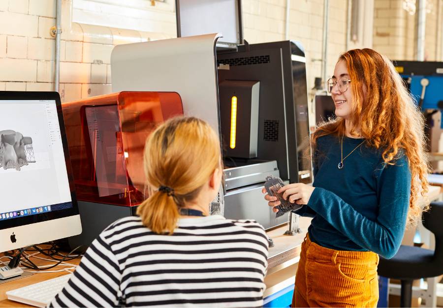 Students at 3D printers