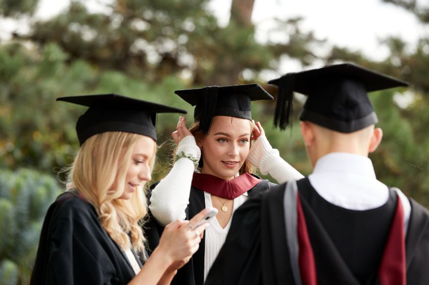 Graduates meeting  and checking caps