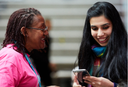 ladies smiling and looking at phone