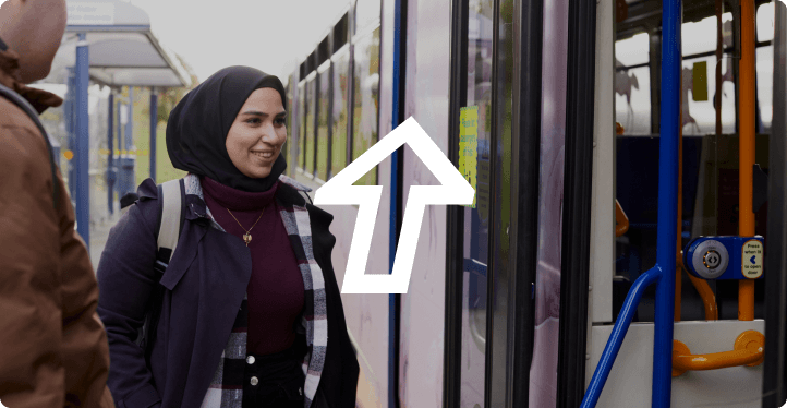 Students on tram with arrow glyph