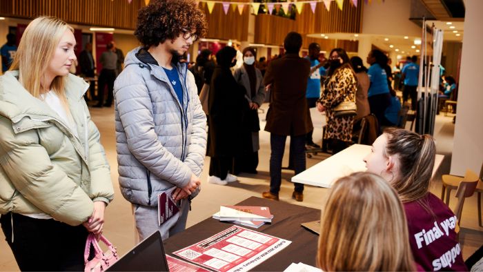 stalls in the atrium with students