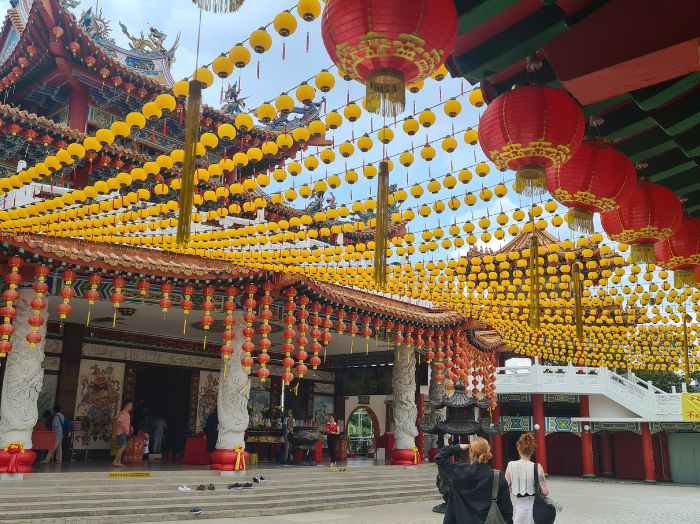 People walking through a temple while studying abroad