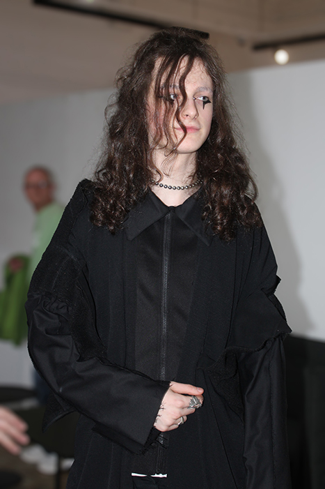 A model wearing some of the black garments that were reworked for the 'Worn Again' project.