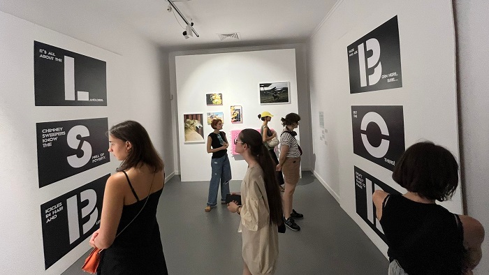Group of people looking at an exhibition in an art gallery