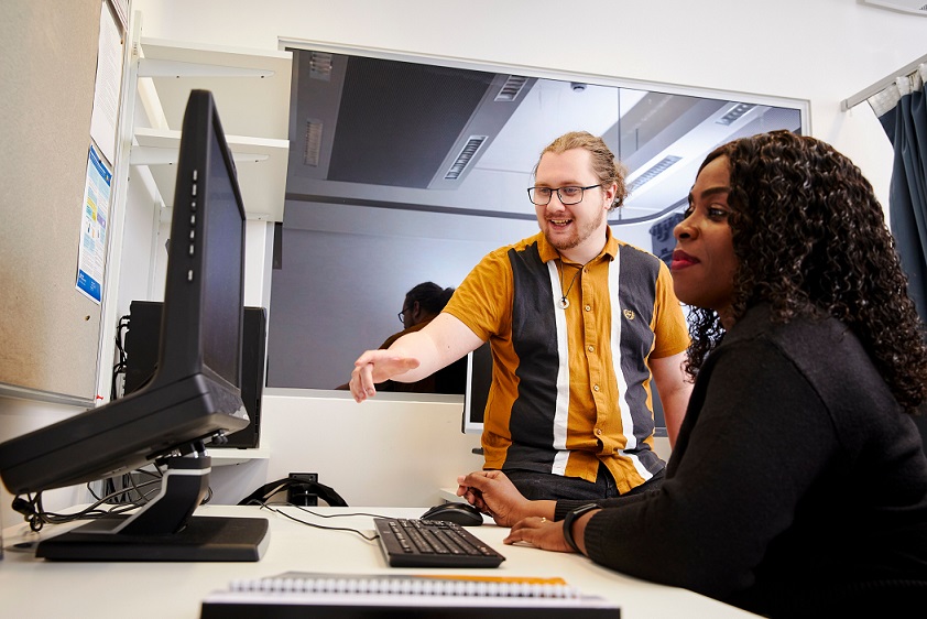 Two students working at a computer