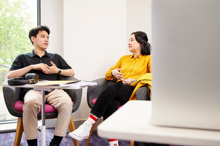 Two students sat talking