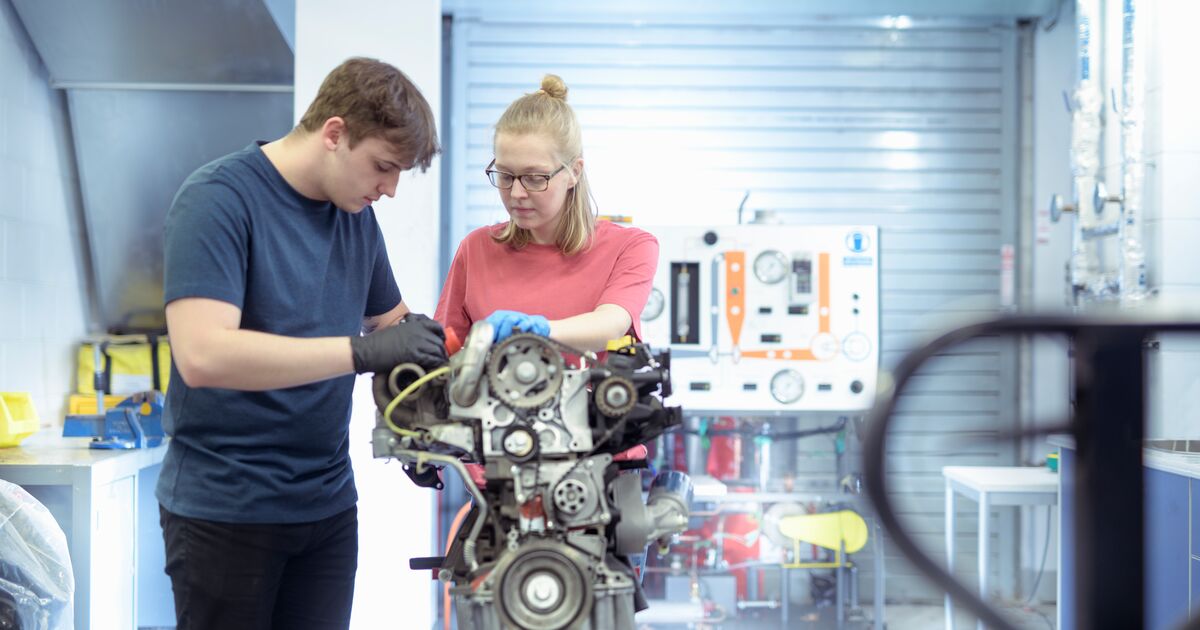 Students working on an engine