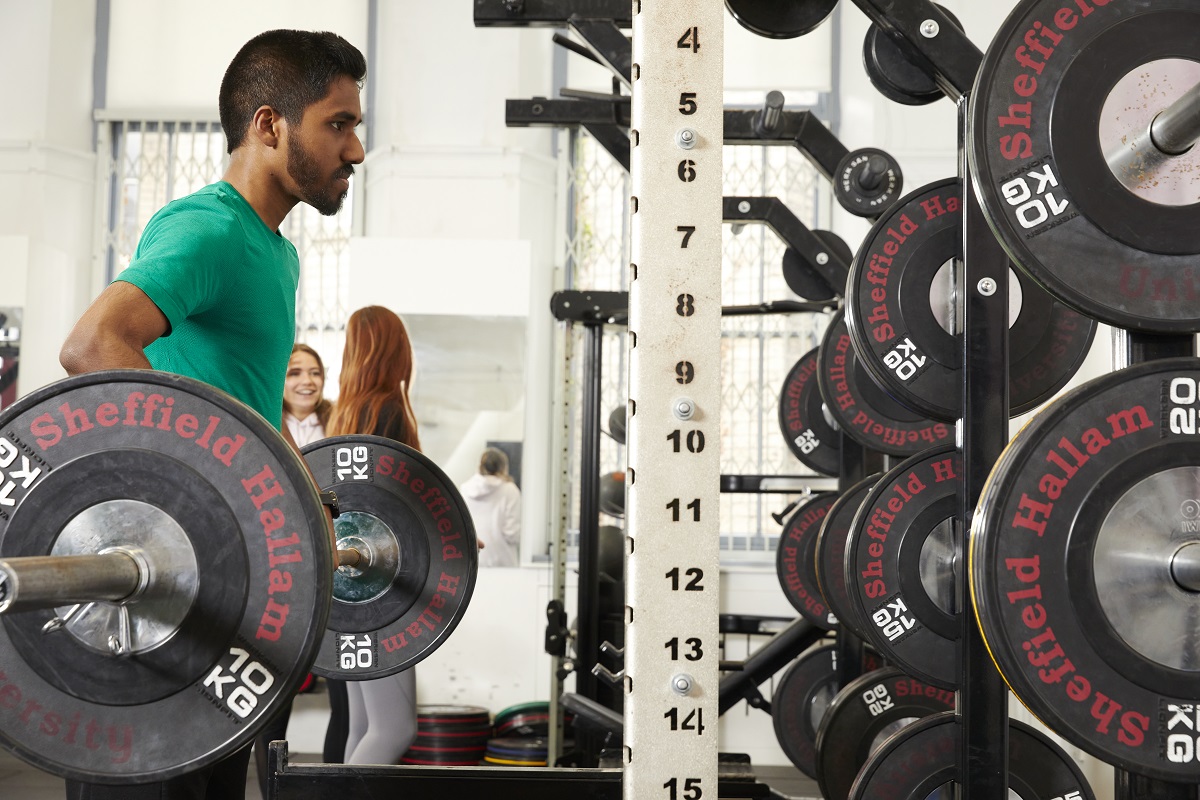 Student lifting weights