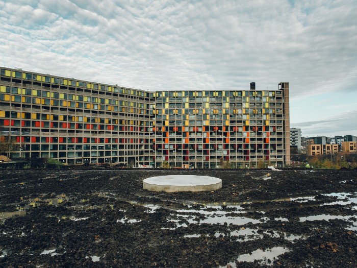 Park Hill flats with sculpture plinth in foreground