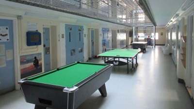 Prison corridor and pool tables 