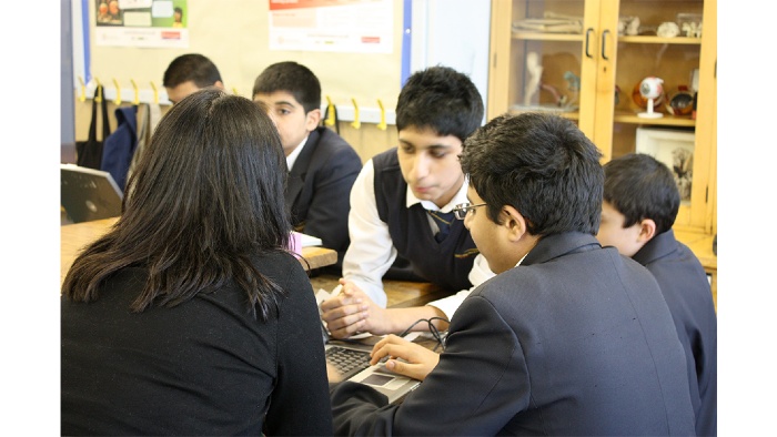 Secondary school students talking during learning