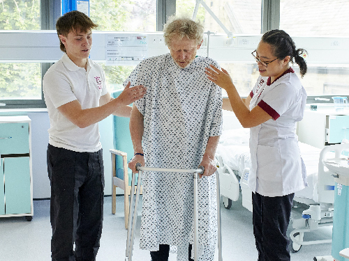 A patient receiving care from healthcare professionals