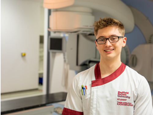 Radiotherapist infront of a linear accelerator