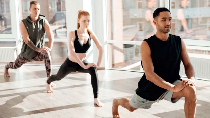 Three students doing yoga